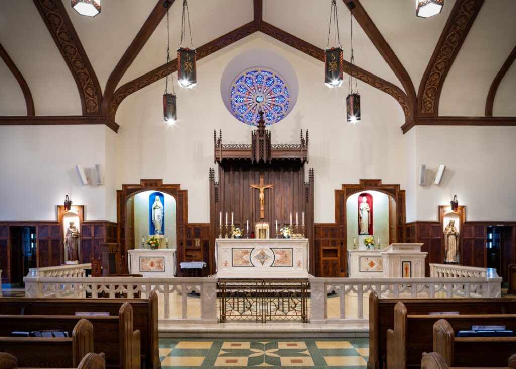 modern church interior with hand-carved stone altar, arches, and natural light symbolizing harmony of tradition and innovation